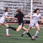 Peyton Wheeler (5) takes a shot for Juneau-Douglas High School: Yadaa.at Kalé during Saturdays game against Ketchikan High School at Adair-Kennedy Field. (Mark Sabbatini / Juneau Empire)