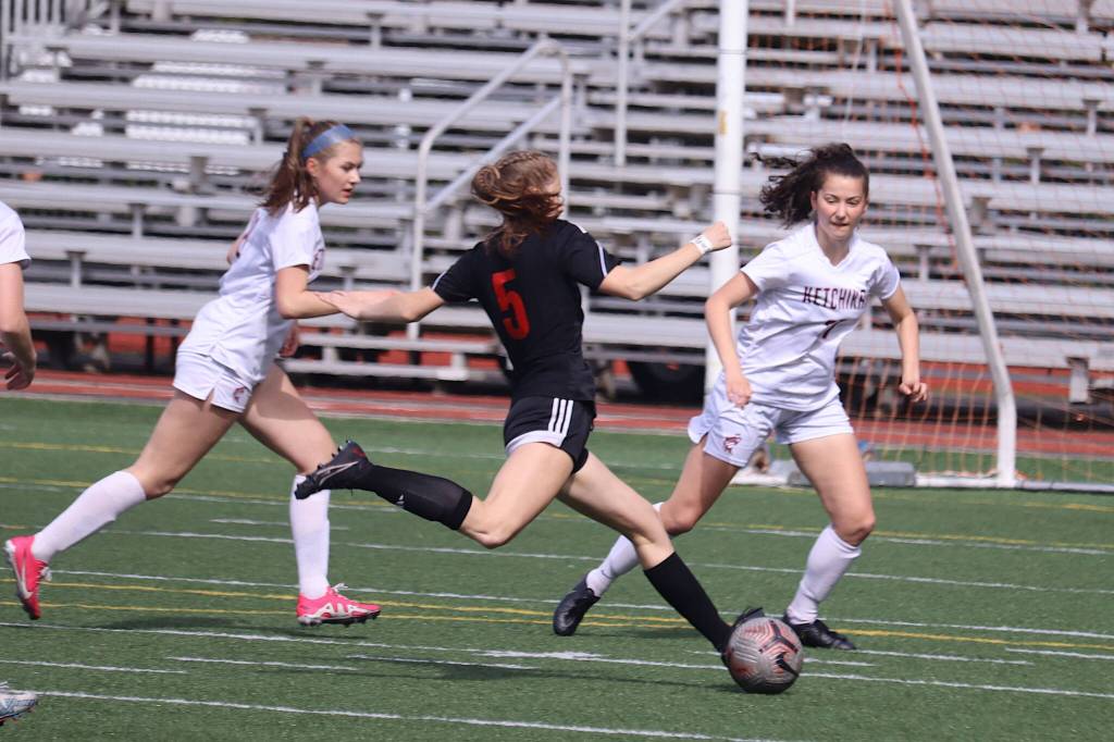 Peyton Wheeler (5) takes a shot for Juneau-Douglas High School: Yadaa.at Kalé during Saturdays game against Ketchikan High School at Adair-Kennedy Field. (Mark Sabbatini / Juneau Empire)