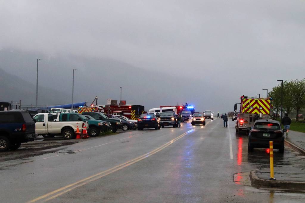 Capital City Fire/Rescue and other emergency officials respond to a fire that engulfed three boats in Douglas Harbor on Monday evening. (Mark Sabbatini / Juneau Empire)
