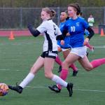 Juneau-Douglas High School: Yadaa.at Kalé Crimson Bears forward Peyton Wheeler (5) scores past Thunder Mountain High School midfielder Randy Stichert (10) during the Falcons final home game Monday at Falcons Field. (Klas Stolpe / For the Juneau Empire)
