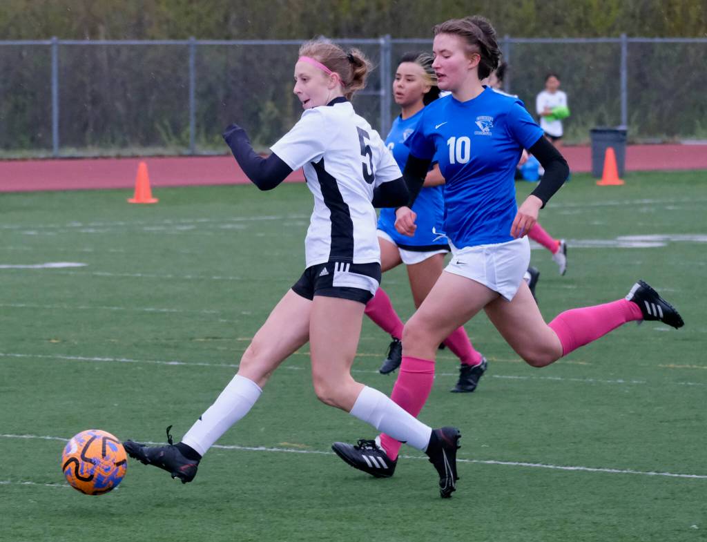 Juneau-Douglas High School: Yadaa.at Kalé Crimson Bears forward Peyton Wheeler (5) scores past Thunder Mountain High School midfielder Randy Stichert (10) during the Falcons final home game Monday at Falcons Field. (Klas Stolpe / For the Juneau Empire)