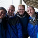 Thunder Mountain High School softball seniors Aliza Mesdag, Ashlyn Gates, Kara Strong, Jenna Dobson and Jack Lovejoy huddle in the dugout before their final career home game Tuesday against Juneau-Douglas High School: Yadaa.at Kalé at Dimond Park Fields. (Klas Stolpe, For the Juneau Empire)