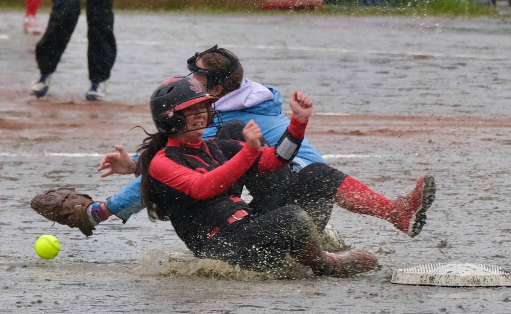 Juneau-Douglas High School: Yadaa.at Kalé senior Tristan Oliva slides safely into second base past Thunder Mountain High School shortstop Ashlyn Gates on Tuesday at Dimond Park Fields. (Klas Stolpe, For the Juneau Empire)