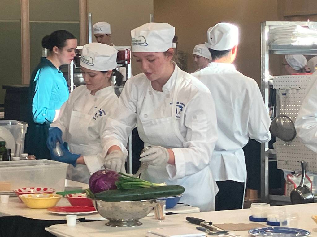 Hannah Watts and Lauren Stichert help prepare a three-course meal for the Thunder Mountain High School culinary arts team during the National ProStart Invitational in Baltimore on April 26-28. (Photo by Rebecca Giedosh-Ruge)