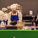 Members of the Thunder Mountain High School culinary arts team prepare their three-course meal during the National ProStart Invitational in Baltimore on April 26-28. (Photo by Rebecca Giedosh-Ruge)
