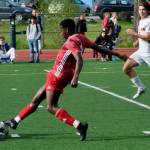 Juneau-Douglas High School: Yadaa.at Kalé junior Ahmir Parker challenges the Ketchikan keeper during the Crimson Bears 4-2 win over the Kings at Adair-Kennedy Field on Friday. (Klas Stolpe / For the Juneau Empire)