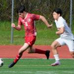 Juneau-Douglas High School: Yadaa.at Kalé senior Sam Cheng (6) moves the ball past Ketchikan defender Kelvin Jiang during the Crimson Bears 4-2 win over the Kings at Adair-Kennedy field on Friday. (Klas Stolpe / For the Juneau Empire)