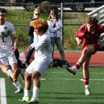 Juneau-Douglas High School: Yadaa.at Kalé junior Kai Ciambor puts a shot past Ketchikans Kingston Dell (11), Alex Gilley (1) and Eunchong Lee during the Crimson Bears 4-2 win over the Kings at Adair-Kennedy Field on Friday. (Klas Stolpe / For the Juneau Empire)