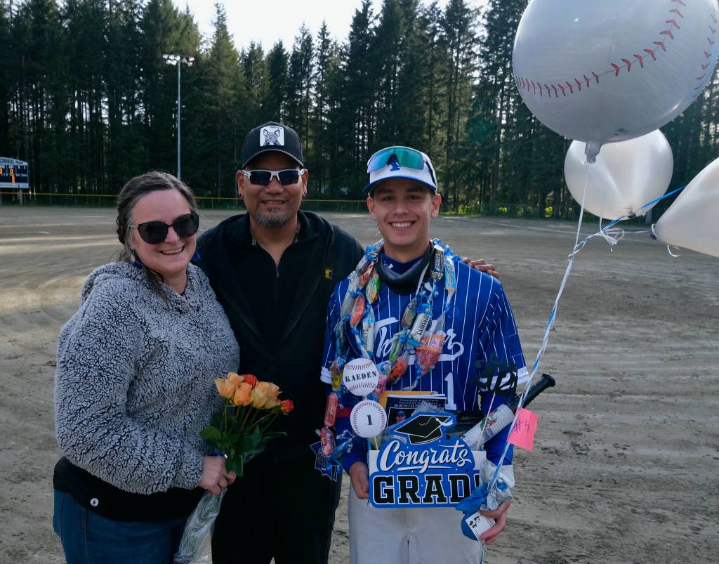 Thunder Mountain High School senior Kaeden Quinto and family during the Falcons senior appreciation on Friday at Adair-Kennedy Field. (Klas Stolpe / For the Juneau Empire)