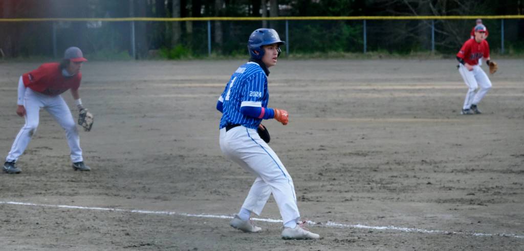 Thunder Mountain High Schools Kaeden Quinto leads off third base. (Klas Stolpe / For the Juneau Empire)