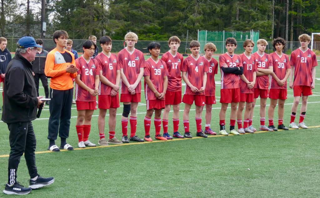 Juneau-Douglas High School: Yadaa.at Kalé head coach Gary Lehnhart addresses his senior players following the Crimson Bears 2-0 title clinching win over the Ketchikan Kings at Adair-Kennedy Field on Saturday. (Klas Stolpe / For the Juneau Empire)