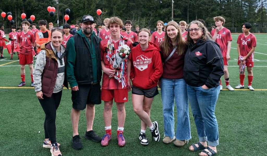 Juneau-Douglas High School: Yadaa.at Kalé senior Caden Johns and family and friends at Adair-Kennedy pitch on Saturday. (Klas Stolpe / For the Juneau Empire)