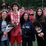 Juneau-Douglas High School: Yadaa.at Kalé senior Sonny Monsef and family and friends at Adair-Kennedy pitch on Saturday. (Klas Stolpe / For the Juneau Empire)