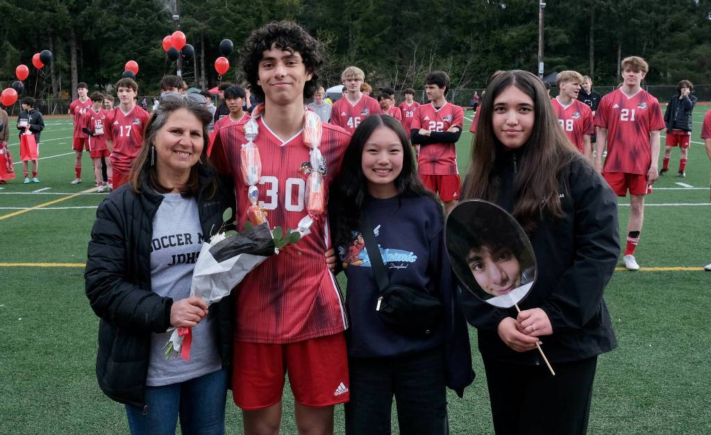 Juneau-Douglas High School: Yadaa.at Kalé senior Sonny Monsef and family and friends at Adair-Kennedy pitch on Saturday. (Klas Stolpe / For the Juneau Empire)