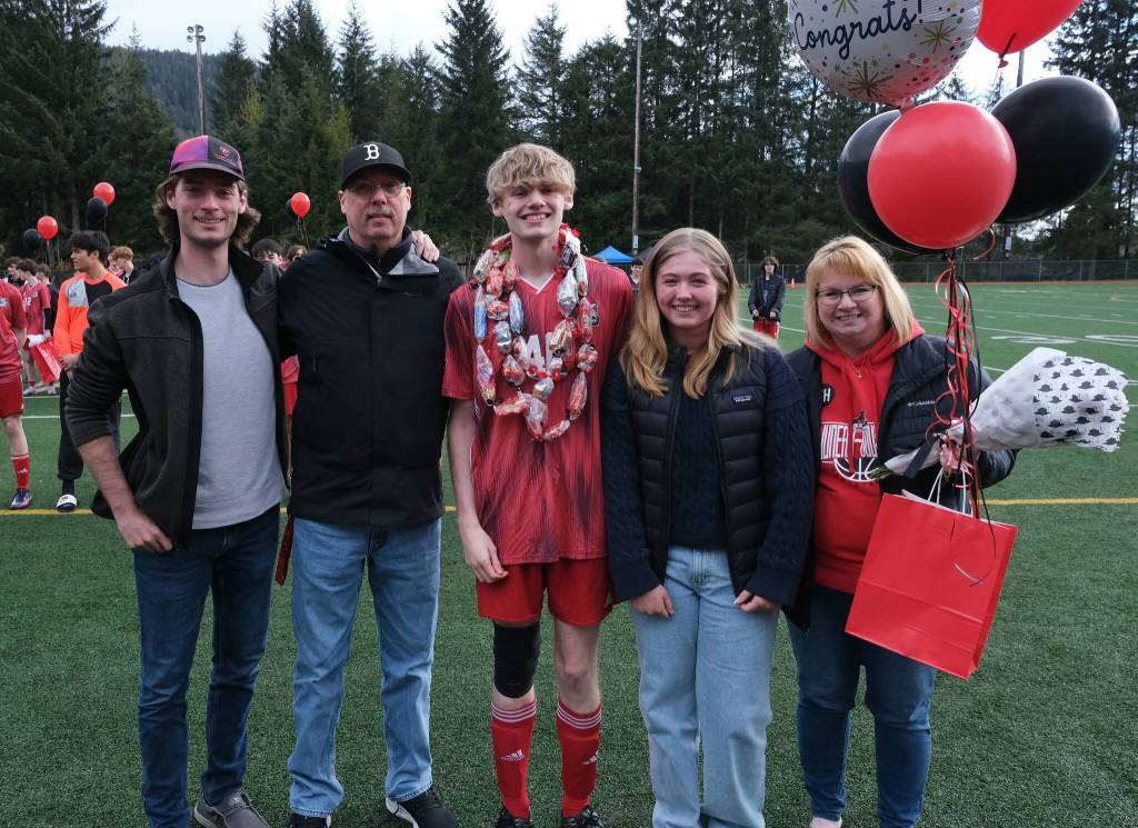 Juneau-Douglas High School: Yadaa.at Kalé senior Jonathan Sleppy and family at Adair-Kennedy pitch on Saturday. (Klas Stolpe / For the Juneau Empire)