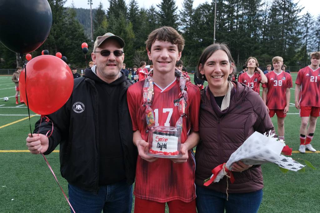 Juneau-Douglas High School: Yadaa.at Kalé senior Aaron Standerwick and family at Adair-Kennedy pitch on Saturday. (Klas Stolpe / For the Juneau Empire)