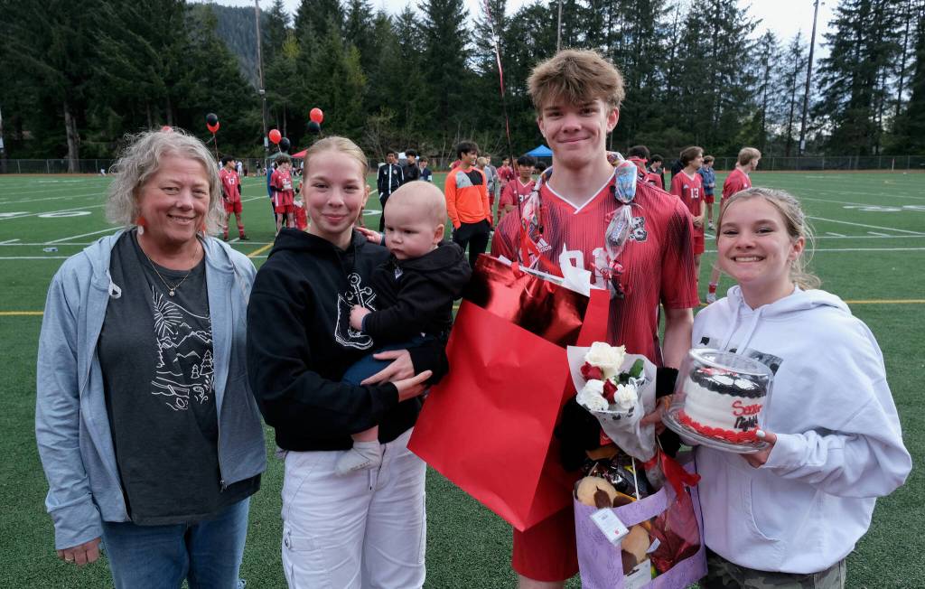 Juneau-Douglas High School: Yadaa.at Kalé senior Justin Durling and family at Adair-Kennedy pitch on Saturday. (Klas Stolpe / For the Juneau Empire)