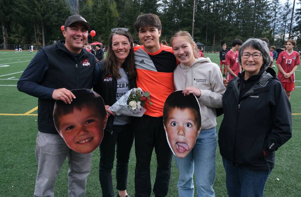 Juneau-Douglas High School: Yadaa.at Kalé senior Alex Mallott and family at Adair-Kennedy pitch on Saturday. (Klas Stolpe / For the Juneau Empire)