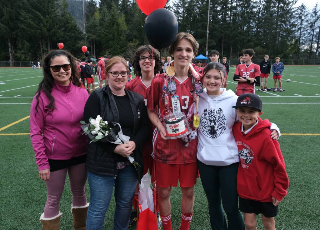 Juneau-Douglas High School: Yadaa.at Kalé senior Xavier Melancon and family and friends at Adair-Kennedy pitch on Saturday. (Klas Stolpe / For the Juneau Empire)
