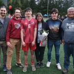 Juneau-Douglas High School: Yadaa.at Kalé senior Sam Cheng and family at Adair-Kennedy pitch on Saturday. (Klas Stolpe / For the Juneau Empire)