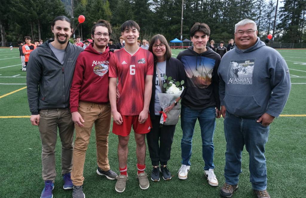 Juneau-Douglas High School: Yadaa.at Kalé senior Sam Cheng and family at Adair-Kennedy pitch on Saturday. (Klas Stolpe / For the Juneau Empire)