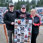 Erik McCormick, center, shown with son Brock and wife Melissa, was honored by the Juneau-Douglas High School: Yadaa.at Kalé baseball team on Saturday for his 30 years of community baseball service. (Klas Stolpe / For the Juneau Empire)