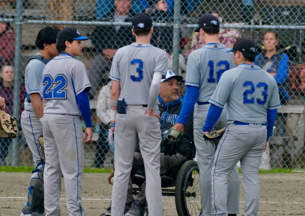 Thunder Mountain High School coach Joe Tompkins talks to the Falcons during their game against the Juneau-Douglas High School: Yadaa.at Kalé Crimson Bears at Adair-Kennedy Field on Saturday. (Klas Stolpe / For the Juneau Empire)