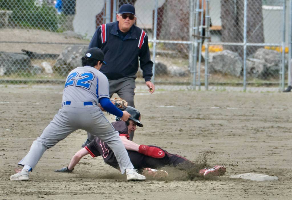 Juneau-Douglas High School: Yadaa.at Kalé freshman Noah Lewis slides safely past Thunder Mountain High School second baseman Madden Mendoza (22) during the Crimson Bears 3-0 win over the Falcons at Adair-Kennedy Field on Saturday. (Klas Stolpe / For the Juneau Empire)