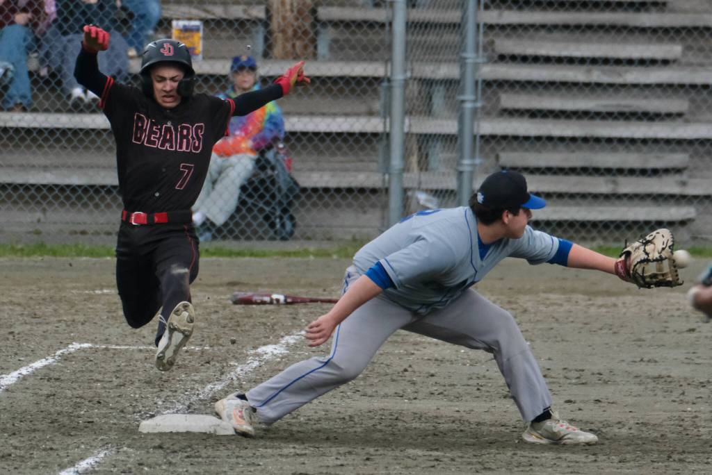 Juneau-Douglas High School: Yadaa.at Kalé freshman Hunter Carte (7) is put out by Thunder Mountain High School first baseman Marcus Mendoza during the Crimson Bears 3-0 win over the Falcons at Adair-Kennedy Field on Saturday. (Klas Stolpe / For the Juneau Empire)