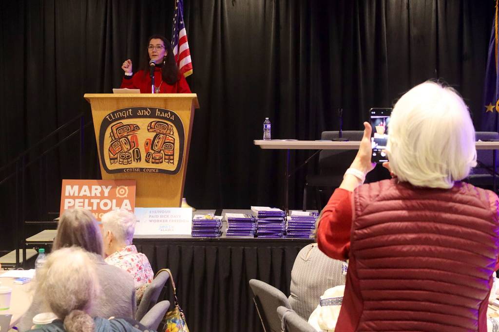 A supporter takes a photo of U.S. Rep. Mary Peltola during her speech at the Alaska Democratic Partys state convention Saturday at Elizabeth Peratrovich Hall. (Mark Sabbatini / Juneau Empire)