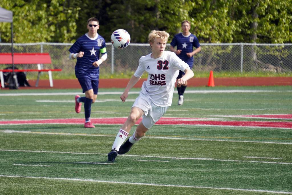 Juneau-Douglas High School: Yadaa.at Kalés Elliot Welch moves with the ball during the ASAA Soccer Division II State Championships at Veterans Memorial Field in Wasilla on Saturday, May 25. (Jake Dye/Peninsula Clarion)