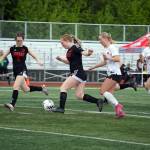 Juneau-Douglas High School: Yadaa.at Kalés Cerys Hudson and Lola Hines move with the ball during the ASAA Soccer Division II State Championships at Veterans Memorial Field in Wasilla on Saturday, May 25. (Jake Dye/Peninsula Clarion)