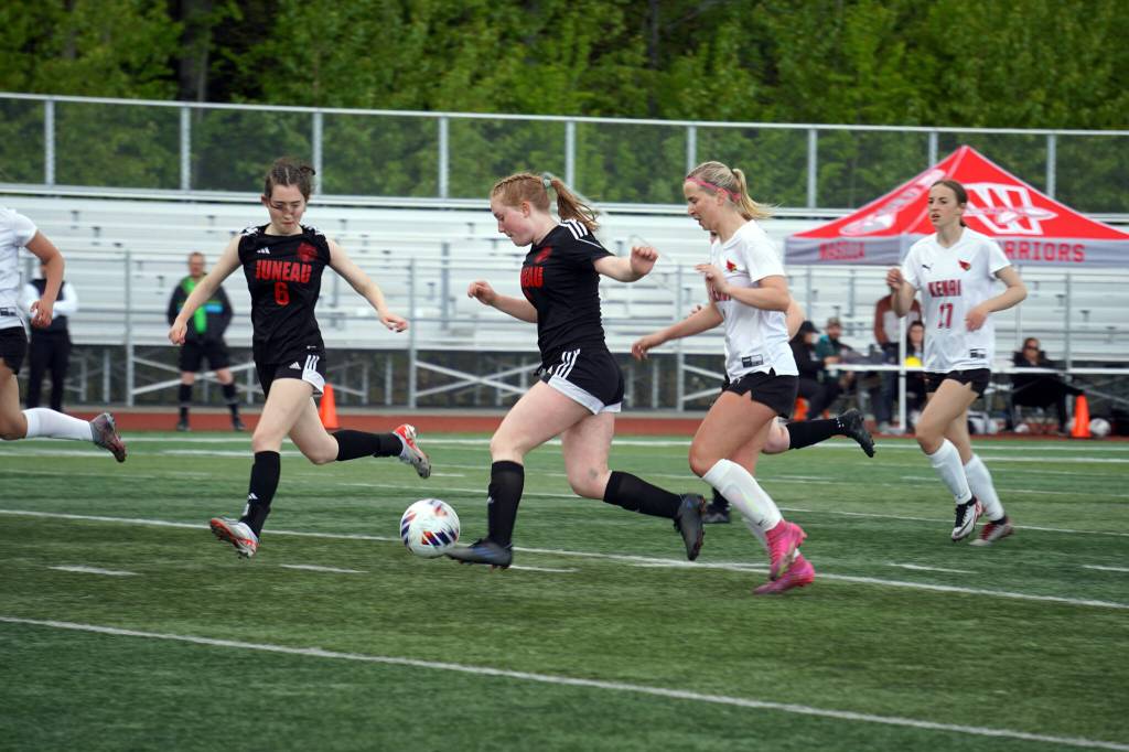 Juneau-Douglas High School: Yadaa.at Kalés Cerys Hudson and Lola Hines move with the ball during the ASAA Soccer Division II State Championships at Veterans Memorial Field in Wasilla on Saturday, May 25. (Jake Dye/Peninsula Clarion)
