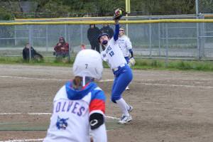 Thunder Mountain High School pitcher Jack Lovejoy catches a line-drive hit to end the Region V softball championship game against Sitka High School on Saturday at Melvin Park. (Mark Sabbatini / Juneau Empire)