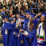 Thunder Mountain High School students move their tassels to the left after receiving their diplomas during Sundays commencement ceremony. (Jasz Garrett / Juneau Empire)