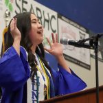 Thunder Mountain High School graduate Elizabeth Djajalie sings the National Anthem at Sundays commencement ceremony. (Jasz Garrett / Juneau Empire)