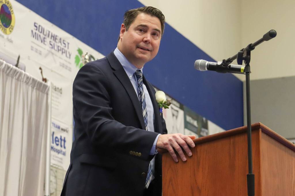 Thunder Mountain High School Principal Shawn Arnold recognizes graduating students during Sundays commencement ceremony. (Jasz Garrett / Juneau Empire)