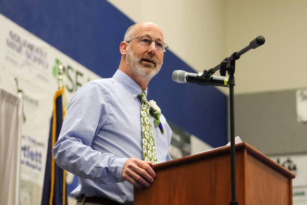 Thunder Mountain High School social studies teacher Jamie Marks gives a speech at Sundays commencement ceremony. (Jasz Garrett/ Juneau Empire)