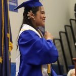 Thunder Mountain High School senior class president Charlene Lumba leads the tassel ceremony during Sundays commencement. (Jasz Garrrett / Juneau Empire)