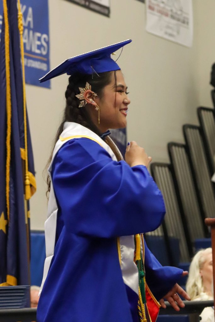 Thunder Mountain High School senior class president Charlene Lumba leads the tassel ceremony during Sundays commencement. (Jasz Garrrett / Juneau Empire)