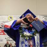 Thunder Mountain High School graduate Primo Nauer calls out to family after receiving his diploma during Sundays commencement ceremony. (Jasz Garrett / Juneau Empire)