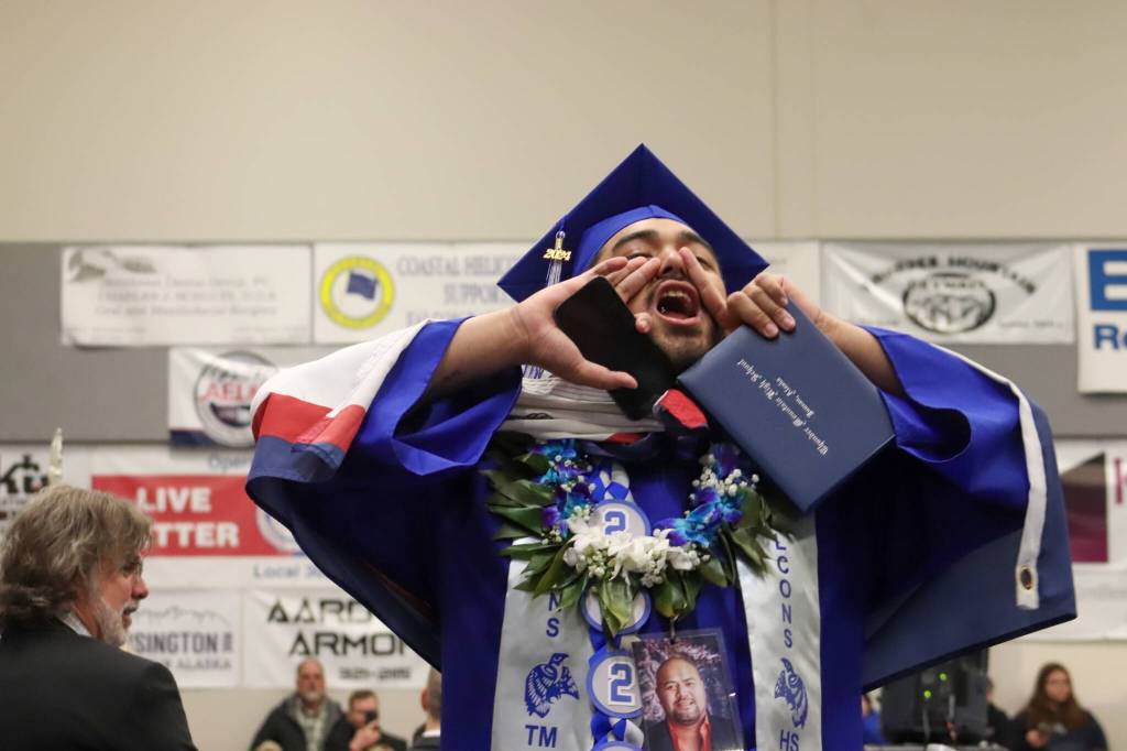 Thunder Mountain High School graduate Primo Nauer calls out to family after receiving his diploma during Sundays commencement ceremony. (Jasz Garrett / Juneau Empire)