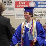 Thunder Mountain High School graduate Joshua Kessler receives his diploma during Sundays commencement ceremony. (Jasz Garrett / Juneau Empire)