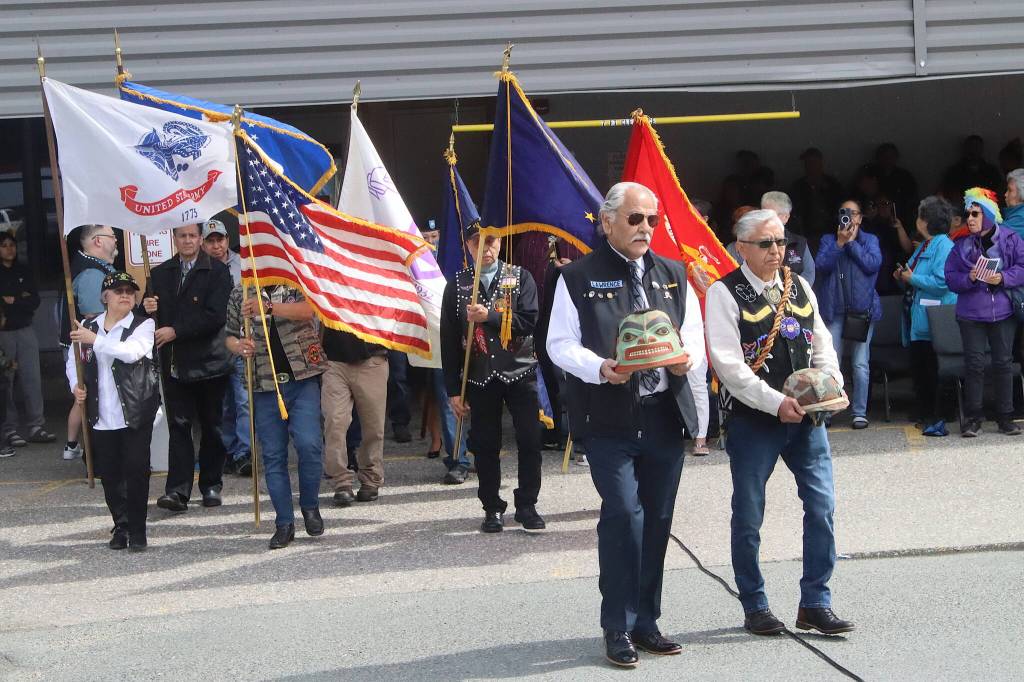 A color guard of Southeast Alaska Native Veterans carries flags to the Southeast Alaska Native Veterans Memorial Park during a Memorial Day ceremony on Monday. (Mark Sabbatini / Juneau Empire)