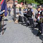 Ray Wilson (right), a Korea War veteran who served in the U.S. Army, helps place a wreath at the Southeast Alaska Native Veterans Memorial Park during a Memorial Day ceremony on Monday. (Mark Sabbatini / Juneau Empire)