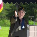 Duff Mitchell, commander of American Legion Auke Bay Post #25, addresses those gathered at a Memorial Day ceremony at Alaskan Memorial Park on Monday. (Jasz Garrett / Juneau Empire)