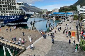 Tourists walk the piers downtown on July 14, 2022. (Michael S. Lockett / Juneau Empire file photo)