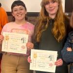 Jade Hicks (left) and Hayden Loggy-Smith hold up their Best Interview award certificates from the See Stories film festival in Anchorage. (Photo courtesy of Janna Lelchuk)