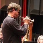 Brian Neal, a trumpet player for Dallas Brass, rehearses with the Juneau Symphony on Thursday night for this weekends concerts at the Juneau-Douglas High School: Yadaa.at Kalé Auditorium. (Mark Sabbatini / Juneau Empire)