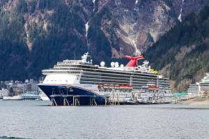 A Carnival cruise ship is berthed Juneaus cruise ship docks during the summer of 2022. (Michael S. Lockett / Juneau Empire file photo)